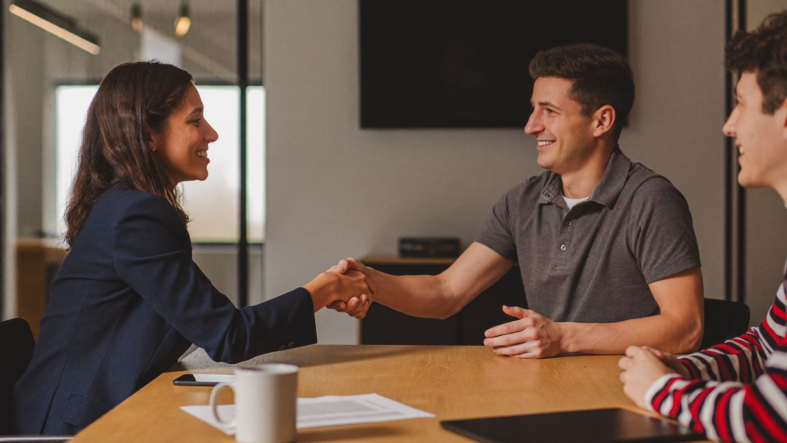 A Vexabit recruiter welcoming a software engineer to an interview